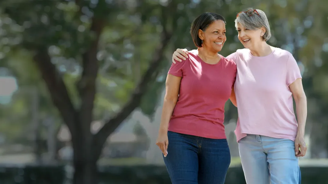 two women talking in park